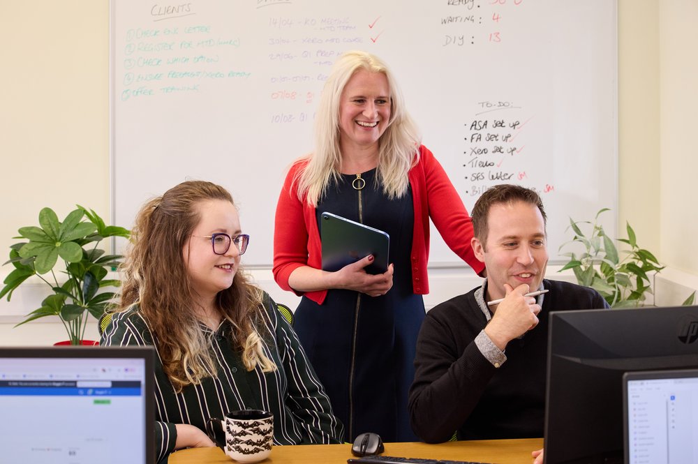Tax team discussing a job