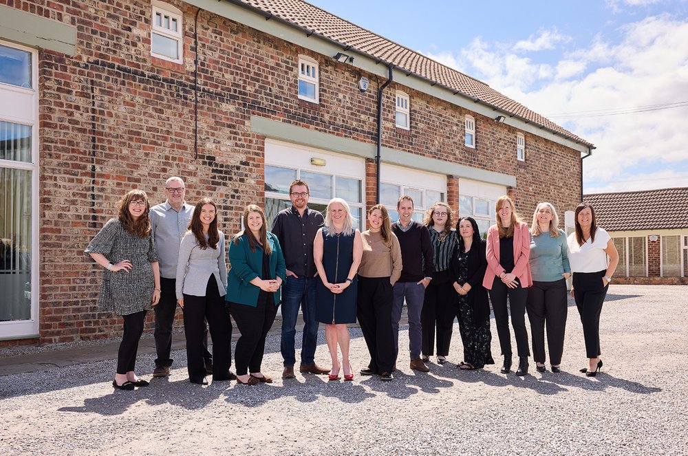 Change Accountants Full Team Photo Outdoors 1